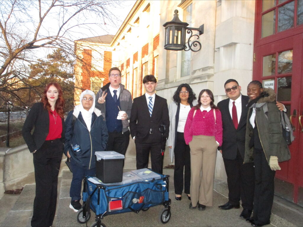 A photo of MTSU Mock Trial team in front of ornate doors. MTSU Law School prep team. 