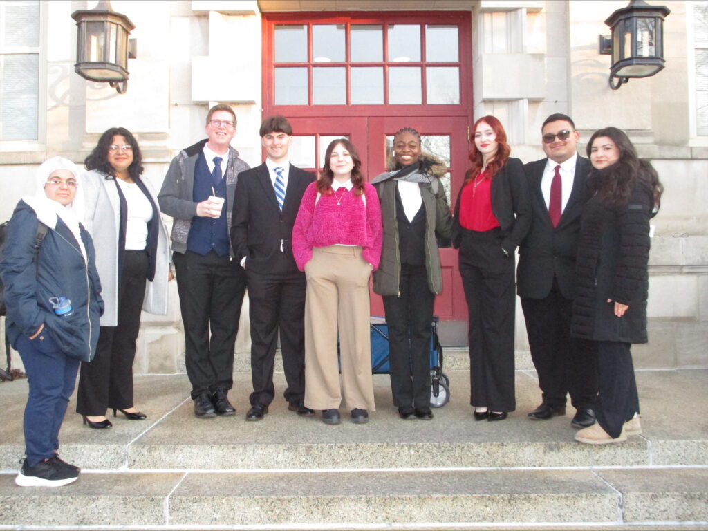 A photo of MTSU Mock Trial team in front of ornate doors. MTSU Law School prep team. 