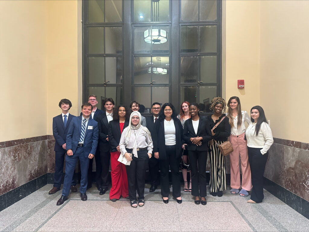 A photo of MTSU Mock Trial team in front of ornate doors. MTSU Law School prep team. 