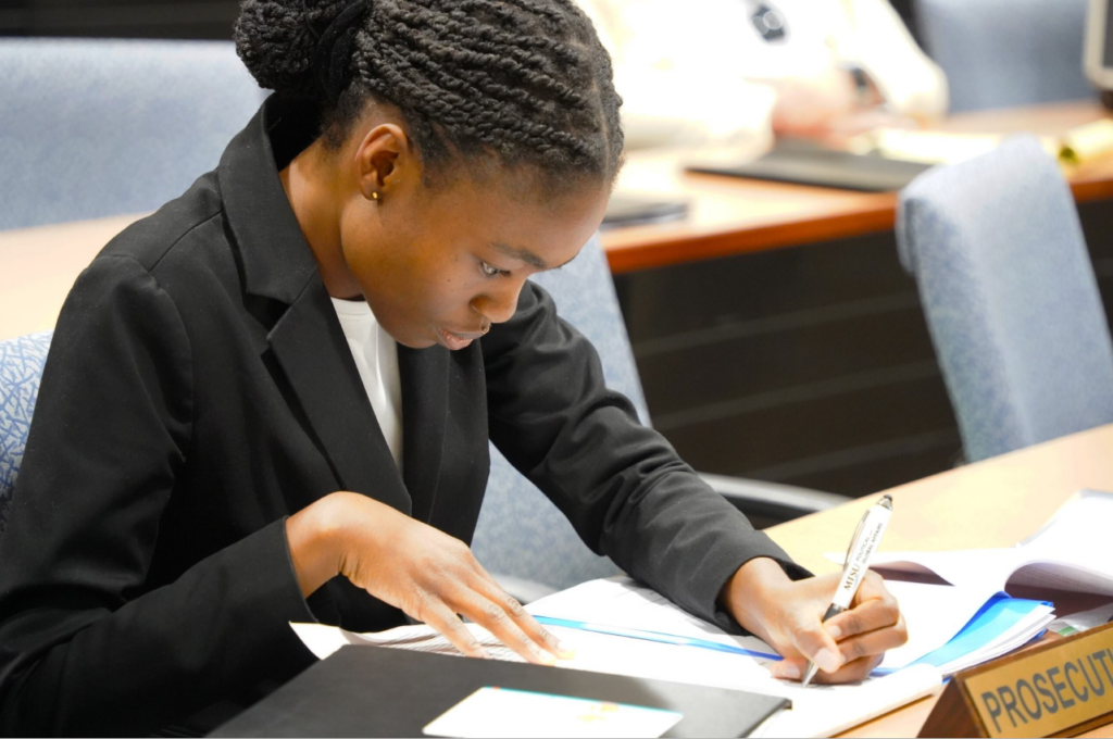 Renee Tetteh writing notes during Mock Trial